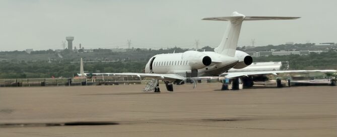 Chris Grollnek, Active Shooter Expert, boarding a private jet on the ramp the travel behind building the P.R.O. Model.