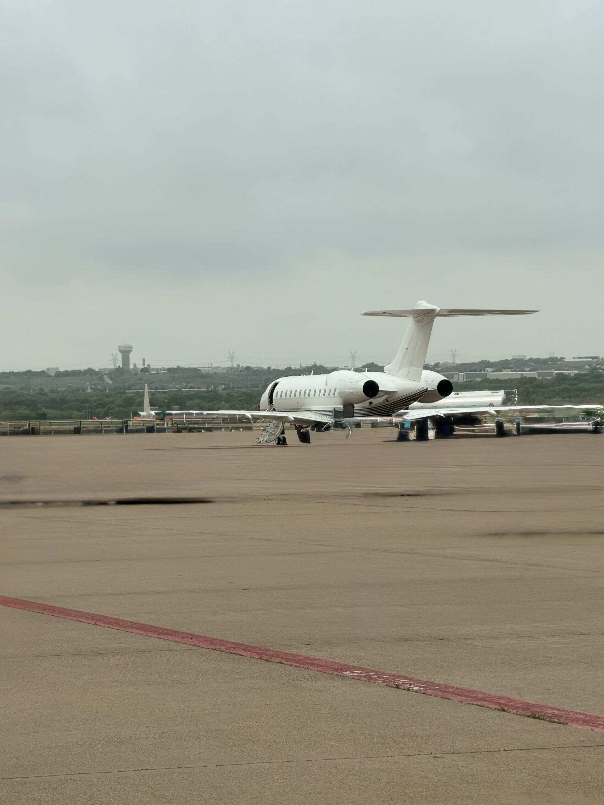 Chris Grollnek, Active Shooter Expert, boarding a private jet on the ramp the travel behind building the P.R.O. Model.